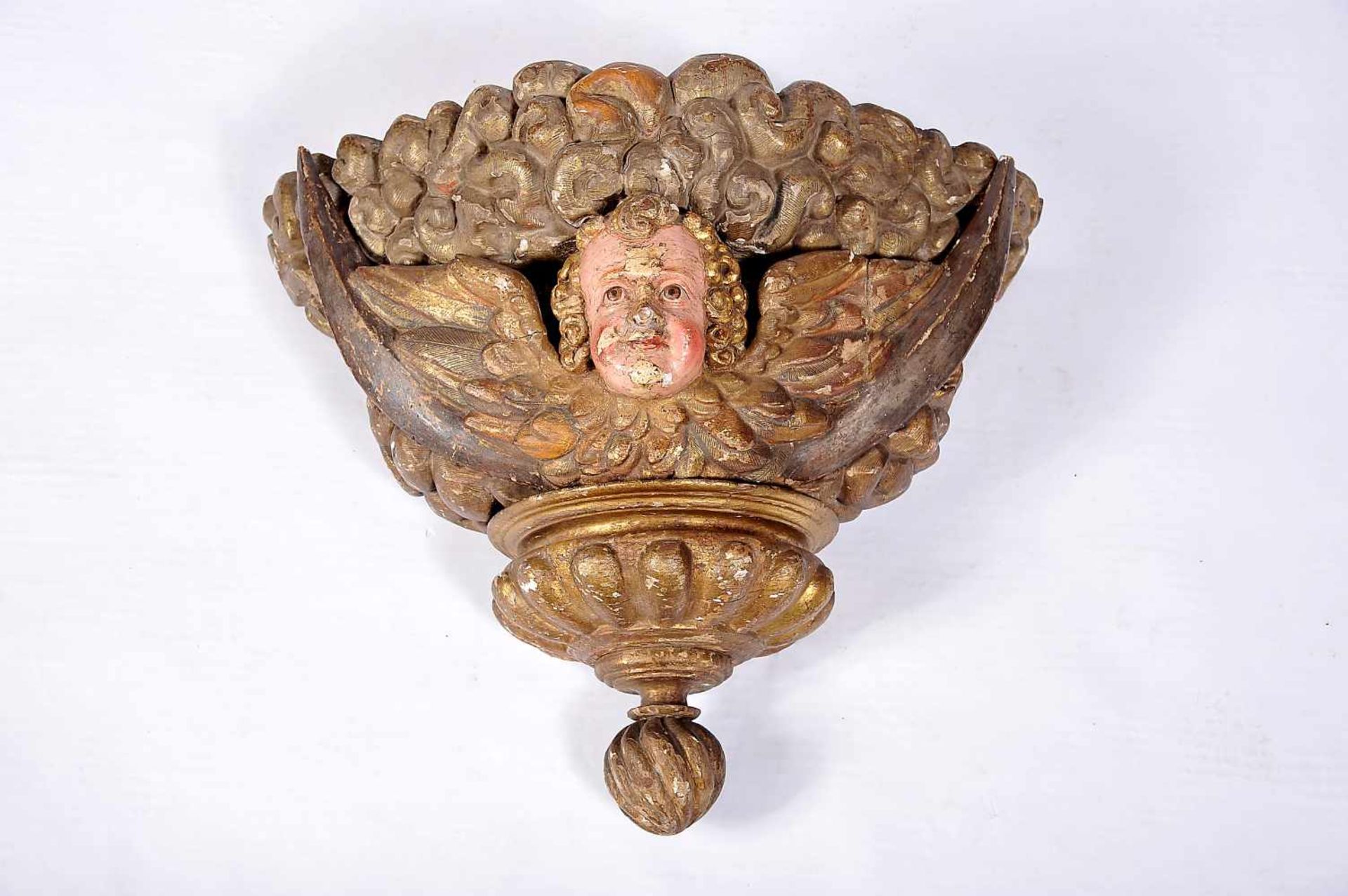 A Large Pedestal, carved, polychrome and gilt wood "Angel head", Portuguese, 18th C., faulst on