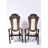 A Pair of Articulated Armchairs, sissoo, fully carved and pierced decoration "Flowers", backrests'