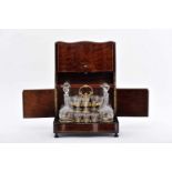 A Liquor Box, Napoleon III, burr-mahogany veneered wood, gilt metal frame with four bottles and