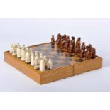 Chess Pieces and Board/Box, carved ivory "Japanese Figures" being one of the sets dyed brown, box