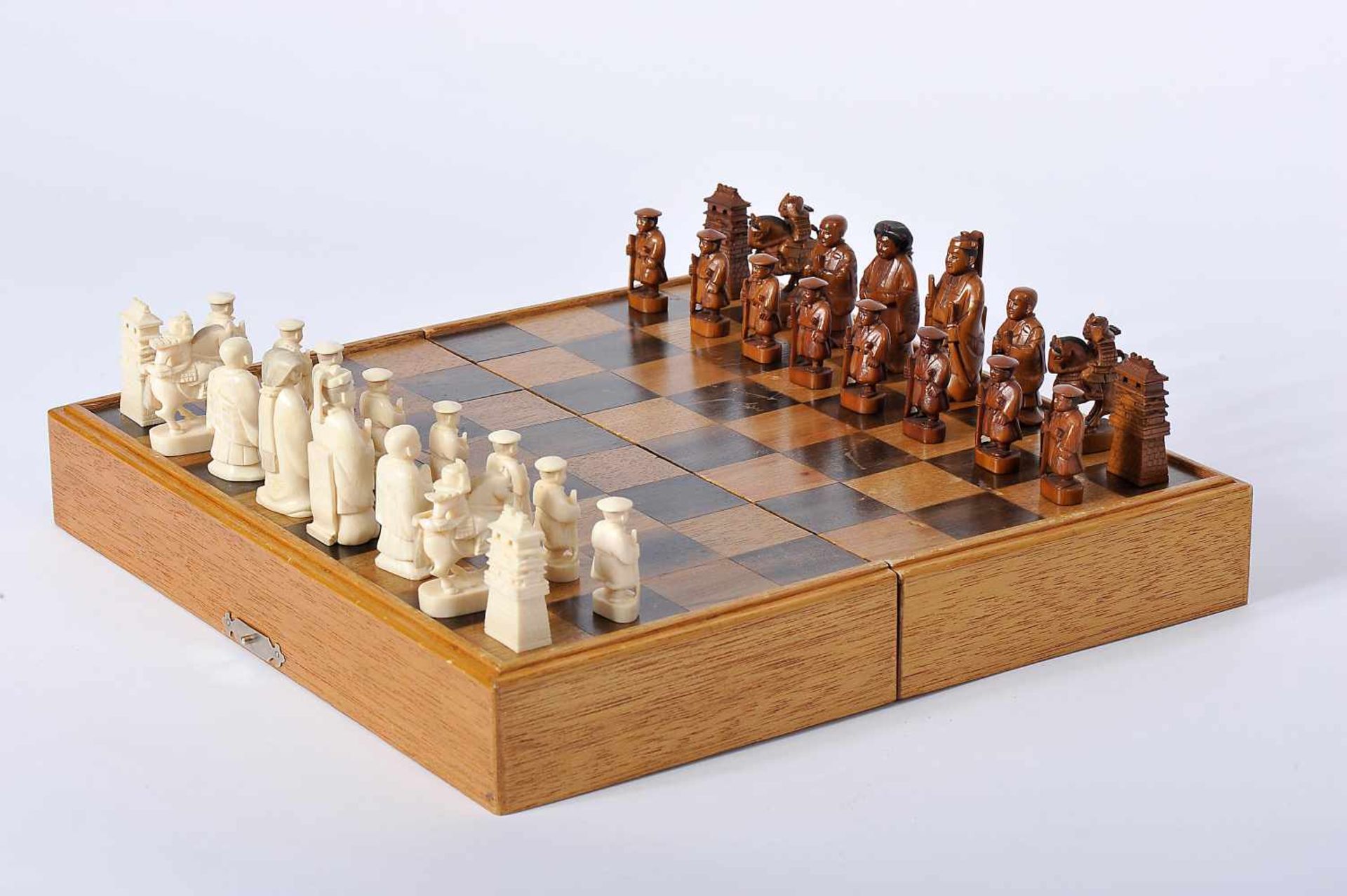 Chess Pieces and Board/Box, carved ivory "Japanese Figures" being one of the sets dyed brown, box