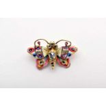 A Brooch - "Butterfly", gold, decorated with enamels, set with crowned table and rose cut