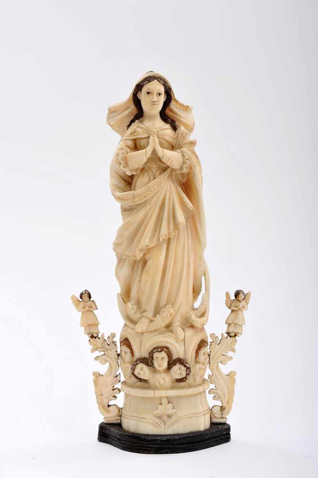 Our Lady of the Immaculate Conception flanked by Angels, partly polychrome ivory sculpture, carved