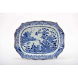 A Large Scalloped Platter, Chinese export porcelain, blue decoration "Garden with birds and