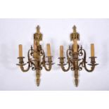 A Pair of Three-light Wall Sconces, Louis XVI style, chiselled and gilt bronze en relief, French,