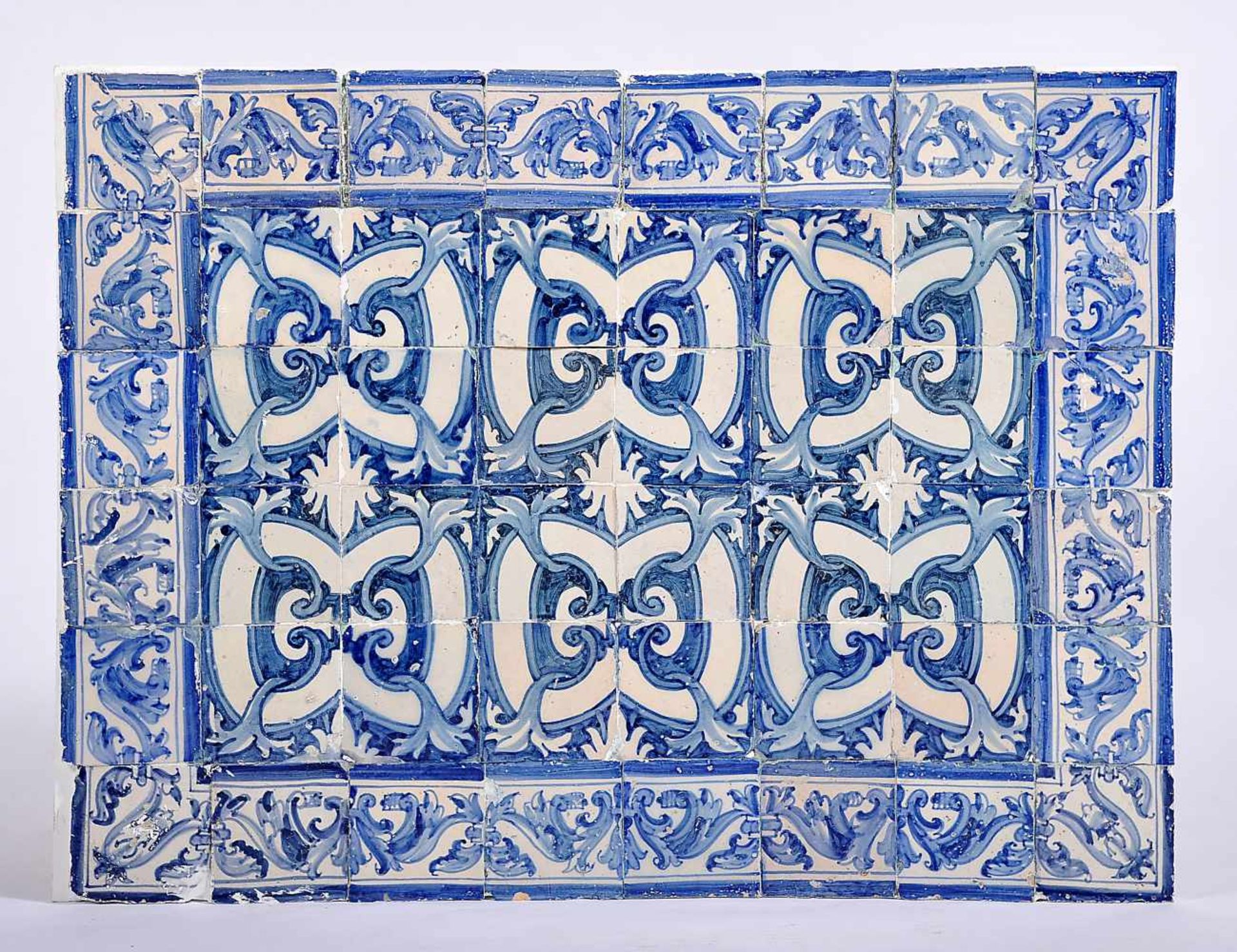 Fleurons, forty-eight tiles panel, blue and white decoration, Portuguese, 17th C., replaced part