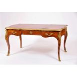A Bureau-plat, Louis XV style, oak structure lined with burr-mahogany marquetry, leather-lined top