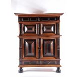 A Two-body Glassware Cabinet, oak, Brazilian rosewood and ebony fronts, padded doors, ripple moulded