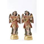 Angels Musicians, a pair of gilt and polychrome wood sculptures, Central Europe, 18th C., minor