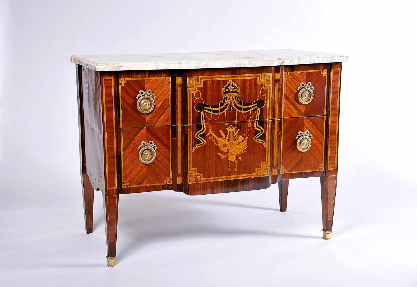 A Chest of Drawers, neoclassical, Brazilian rosewood, satinwood and greenwood marquetry "Baldachin