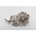 A Brooch - "Flower", 950/1000 platinum, set with rose cut diamonds and 21 brilliant cut ones with an