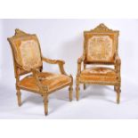 A Pair of Armchairs, Louis XVI style, carved and gilt wood, upholstered seats, backs and armrests,