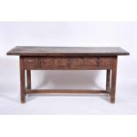 A Large Table, rustic, carved chestnut, iron handles, Portuguese, 17th. C., traces of wood