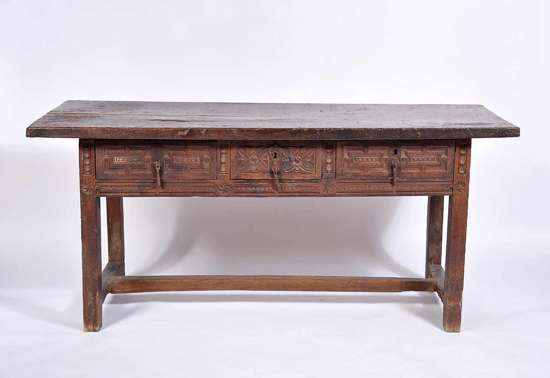 A Large Table, rustic, carved chestnut, iron handles, Portuguese, 17th. C., traces of wood