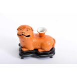 A censer sticks holder "Foo Dog", Chinese export porcelain, monochrome salmon decoration, 19th C.,