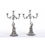 A Pair of Three-light Candelabra, 833/1000 silver, stems en relief "Putti", Portuguese, signs of