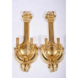 A Pair of Two-light Wall Sconces, Louis XVI style, carved, painted, silvered and gilt chestnut "