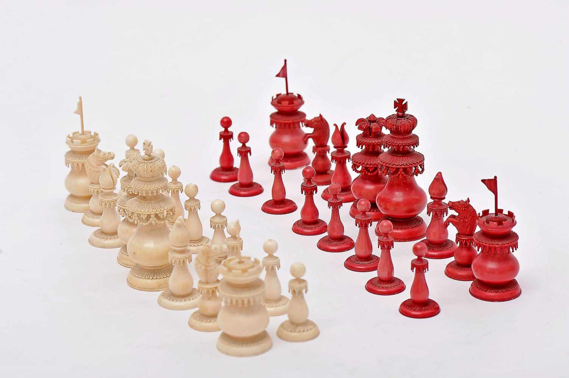 Chess pieces, carved ivory being one of the sets dyed red, India - Vizagapatam, 19th C., Dim. - (