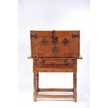 A Bureau with Stand, mannerist, walnut, scalloped and pierced iron mounts, interior with eleven