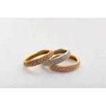 A set of three rings, 800/1000 tricolour gold, set with 111 brilliant cut diamonds with an