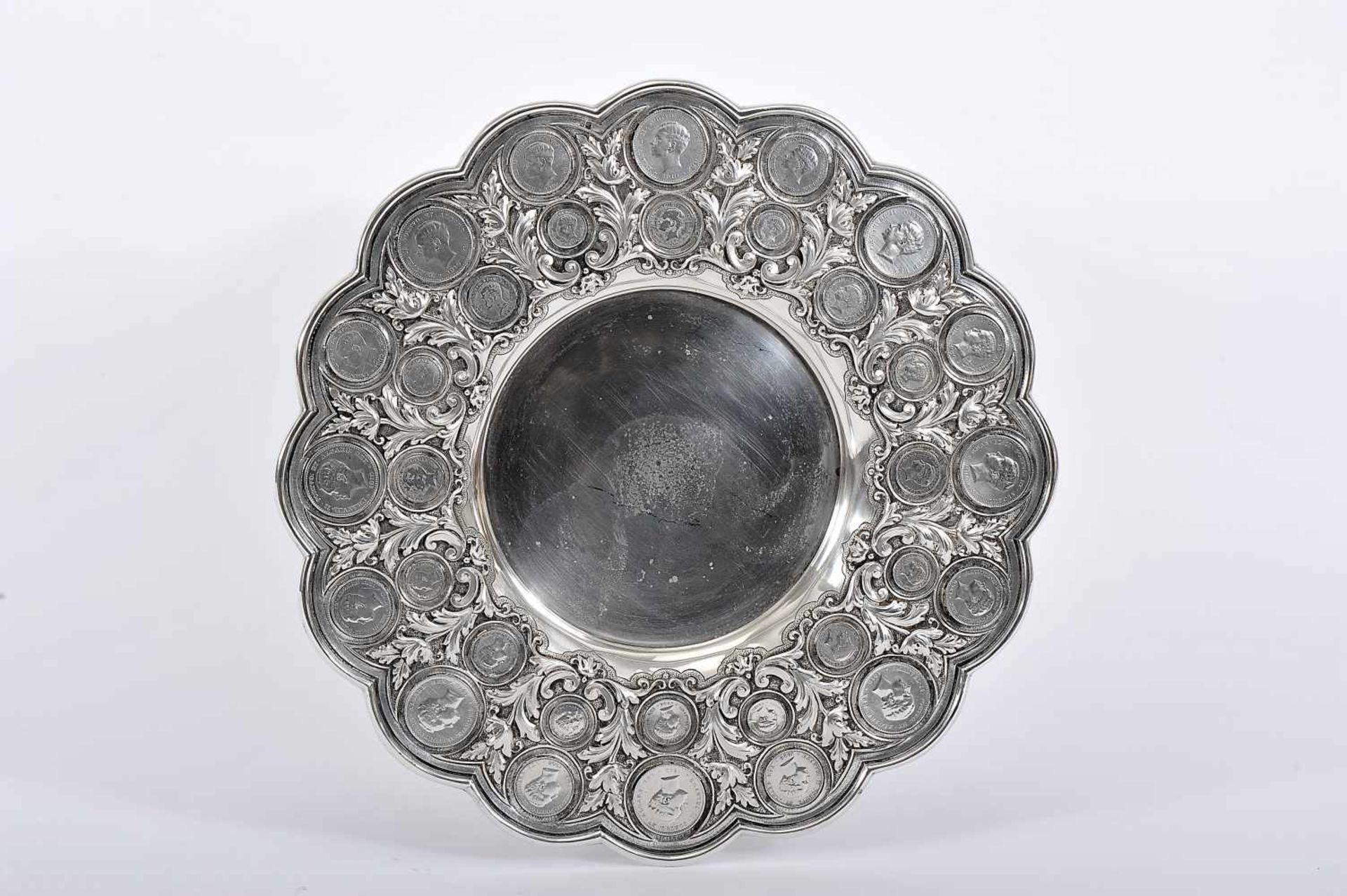 A Polylobate Salver, 833/1000 silver, decoration en relief with thirty-two (32) coins of the reign