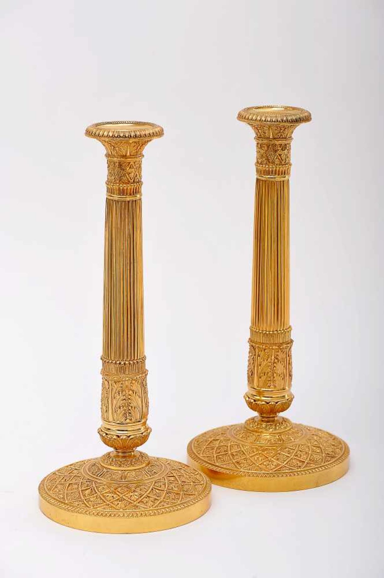 A Pair of Large Candlesticks, Empire style, chiselled and gilt bronze "Fruits and leaves",