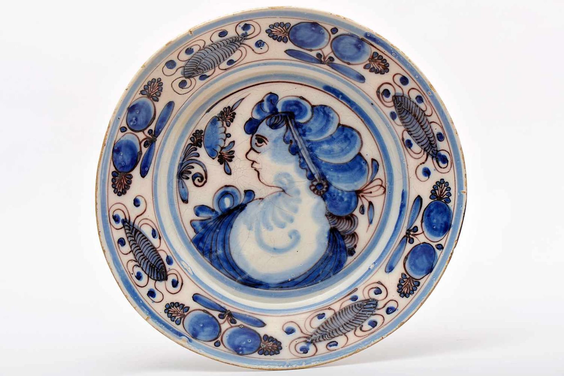 A Dish, faience, blue and vinous «Spiders» decoration, "Female bust profile with hair updo flanked