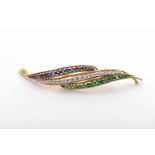 A VAN CLEEF & ARPELS Brooch - Leaf, 750/100 gold, set with 18 emeralds and 18 round brilliant cut