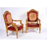 A Pair of Armchairs, Louis XVI style, carved and gilt wood, upholstered backs, seats and armrests,