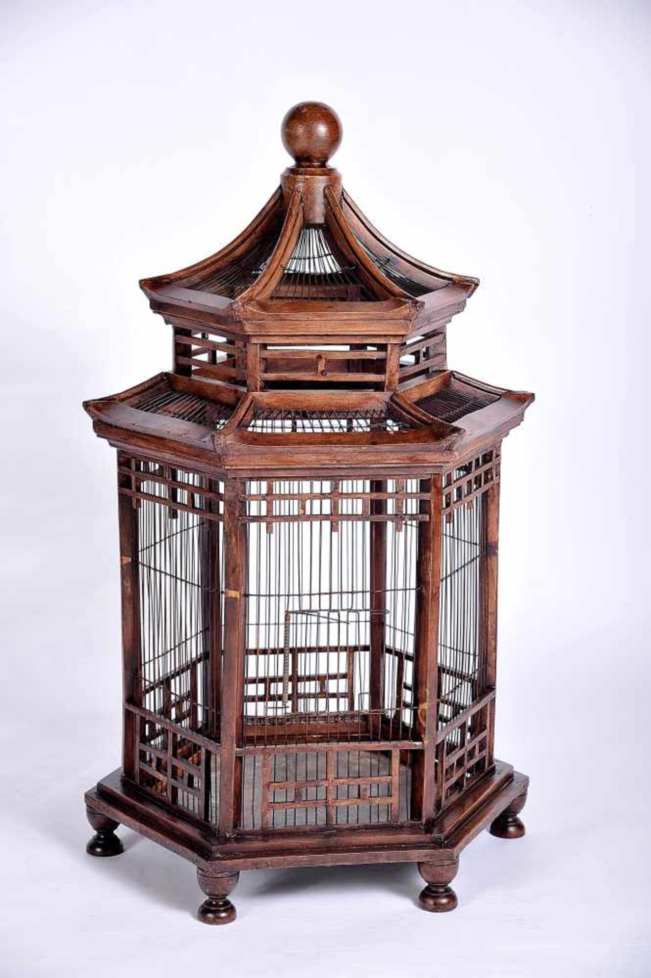 A "Pagoda" Cage, darkened wood, metal grid and tray, European, 19th/20th C., minor defects, Dim. -