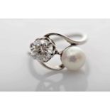 A Ring, 800/1000 gold and 500/1000 platinum, set with natural (untested) pearl and brilliant cut