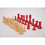 A JACQUES STAUNTON Chess Pieces - SIZE CLUB, carved ivory being one of the sets dyed red, mahogany