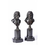 Busts of Voltaire and Rousseau, a pair of patinated bronze sculptures, black marble bases, French,