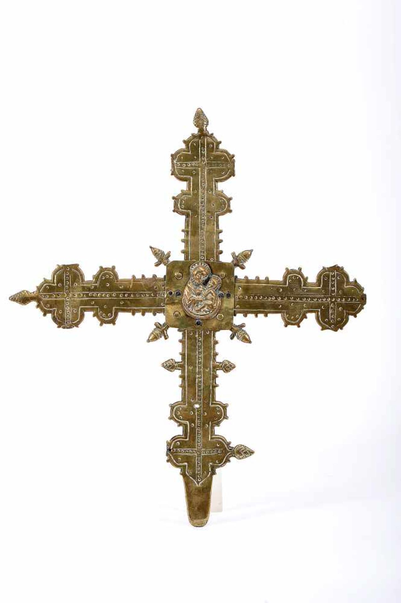 A Processional Cross, gilt bronze, scalloped engraved decoration en relief "Our Lady with the