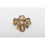 A Brooch, minimum 375/1000 gold, decorated with enamel and set with 15 antique brilliant cut