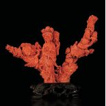 A carved coral group, China, early 1900s - Gross weight 604gr; 19x23.5cm -