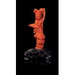 A coral Guanyin, China, early 20th century - 312gr; H 19cm -