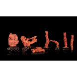 Seven carved coral groups, China, early 1900s - Gross weight 485gr; H from 4cm to 9cm -