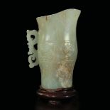 A small jade pitcher, China, Qing Dynasty - Qianlong period (1736-1796). H 10cm -