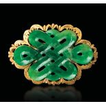 A jade brooch, China, early 1900s - Green jade plaque in the shape of an endless knot [...]