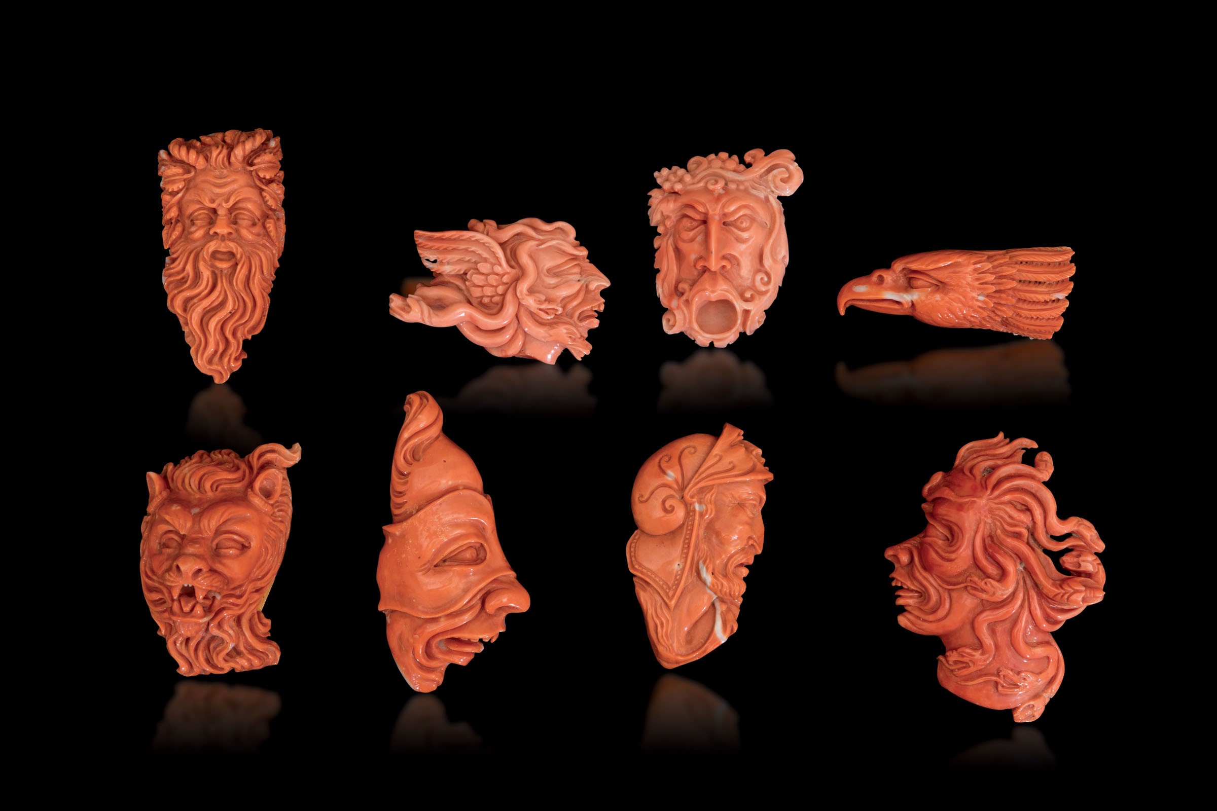 Eight carved coral pendants, China, early 1900s - 338gr; from 5.5cm to 8cm -