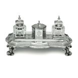 A silver inkstand, London, 1869 - Molten, embossed and chiselled silver and glass. [...]