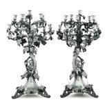 Two silver candle holders, Europe, 18-1900s - Molten, embossed and chiselled silver. [...]