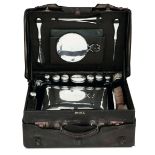 A silver and glass toiletry set within case, London, 1911 - A leather case containing [...]