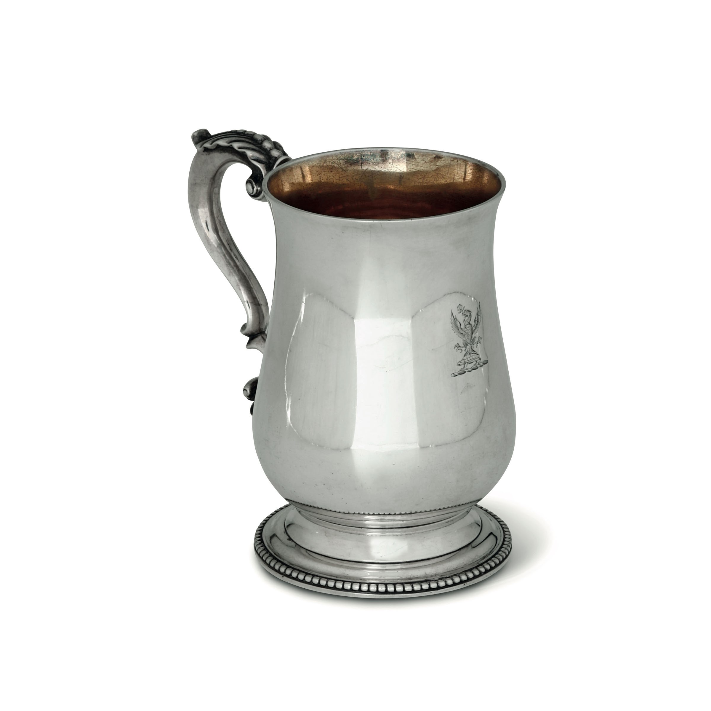 A silver tankard, London, 1858 - Molten and chiselled silver, gilt on the inside. [...]