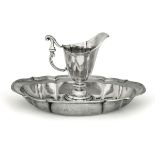 A silver pitcher and basin, Siena, late 1700s - Embossed and chiselled silver. [...]