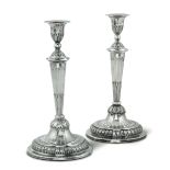 Two silver candle holders, Genoa, 1824 - Molten, embossed and chiselled silver. H 28cm -