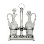 A cruet stand, mid 19th century - Molten, embossed and chiselled silver stand with [...]