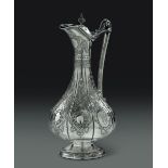 A pitcher in embossed and chiselled silver, London 1881 ca. - - altezza cm 35, gr. [...]