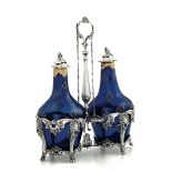 A silver cruet stand, Europe, 18-1900s - - Molten, embossed and chiselled silver and [...]